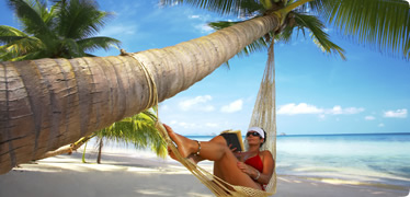 woman lying on a chair on the beach