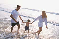 A family enjoying their vacation on the beach